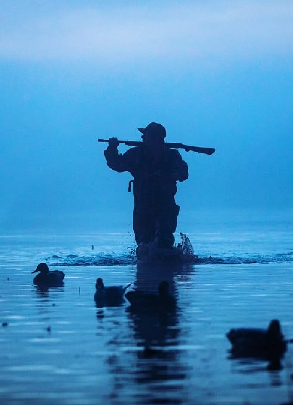 Central Flyway Hunter standing over decoys in Perry, Oklahoma.