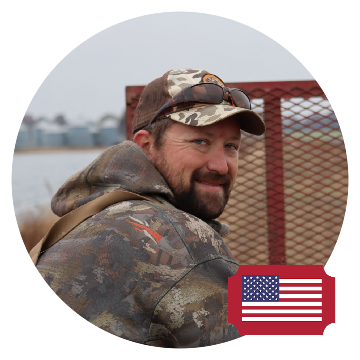 Hunter pictured at sunrise over decoys during a Maryland duck hunt.