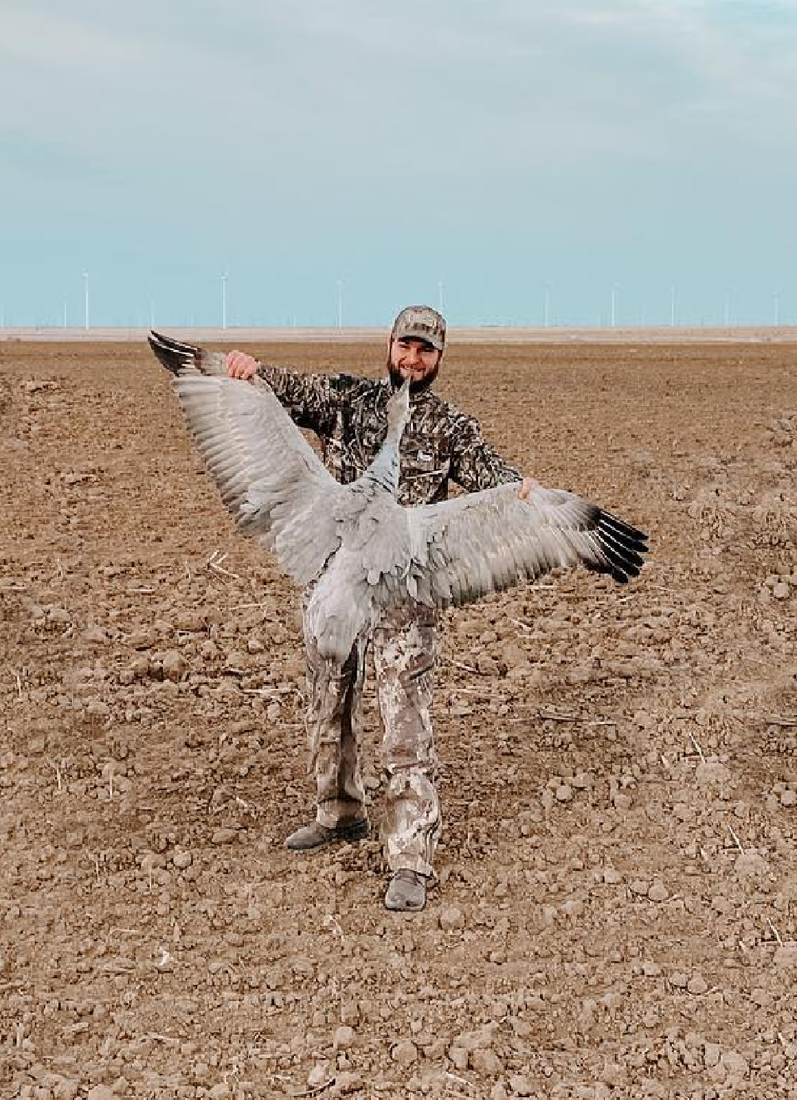 Waterfowl States - Texas (1) Hunter standing over decoys in Perry, Oklahoma.